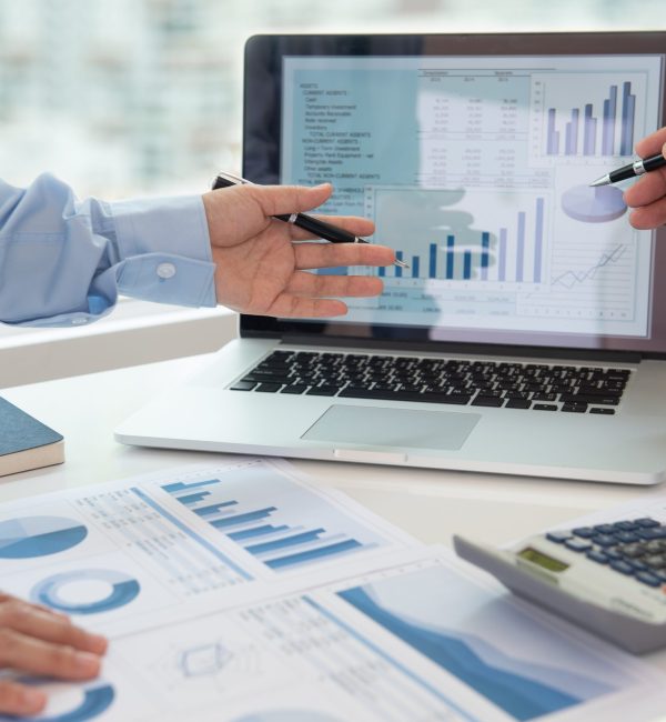 Financial analyst meeting Financial analyst analysis business financial report on digital tablet during discussion at meeting of corporate showing the results of their successful teamwork.
